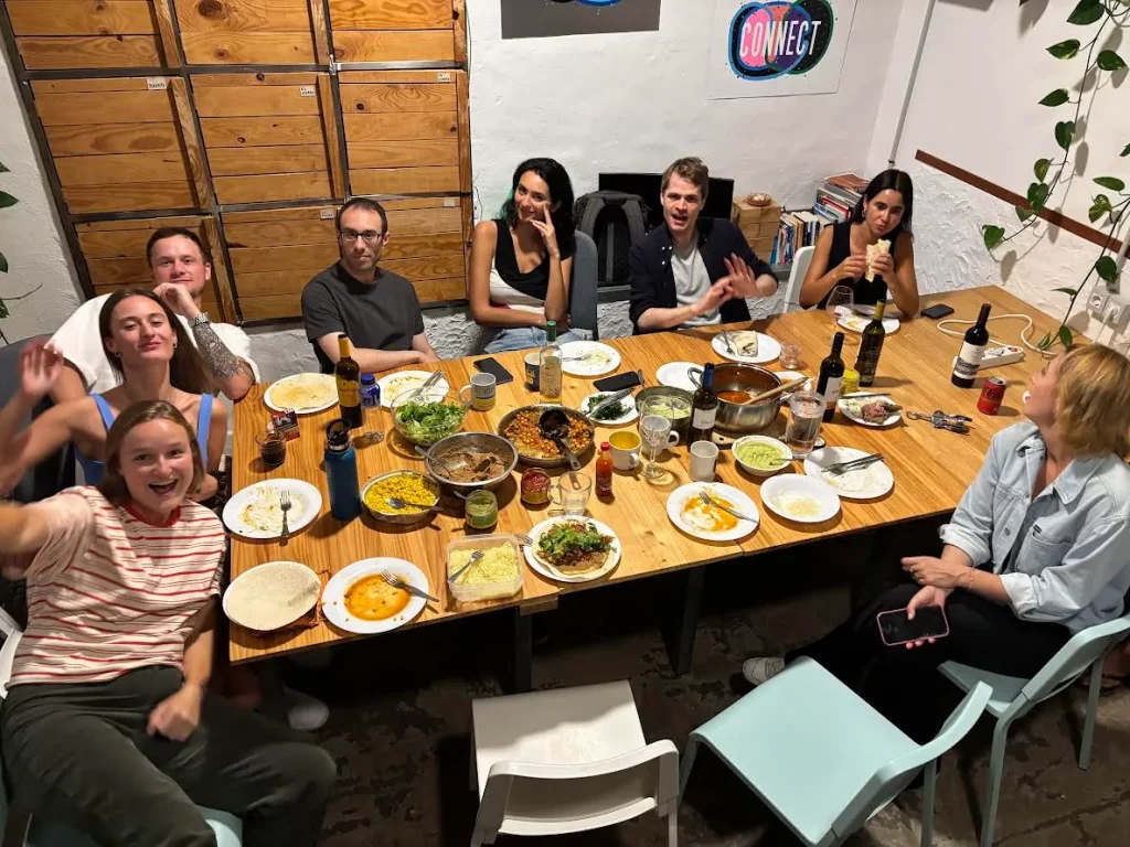 Group of Digital Nomads having dinner in EcoIsleta Coliving